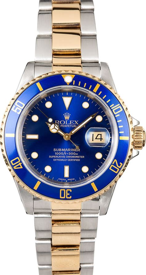 blue and gold Rolex submariner